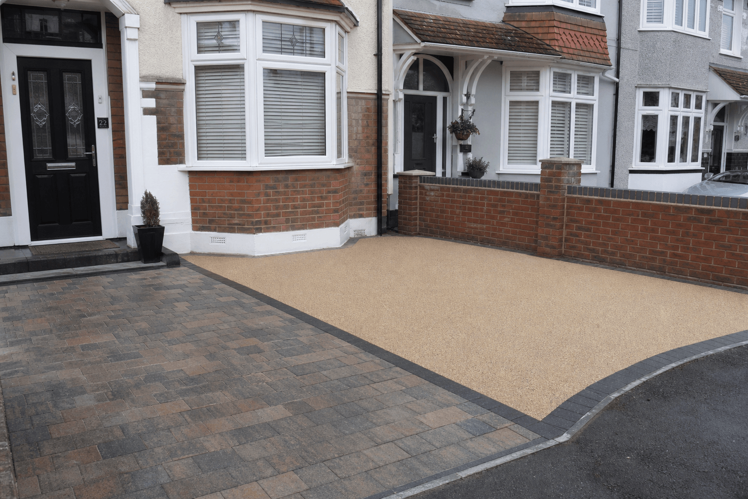 UK front drive showing block paving and resin-bound surfaces on a terraced home
