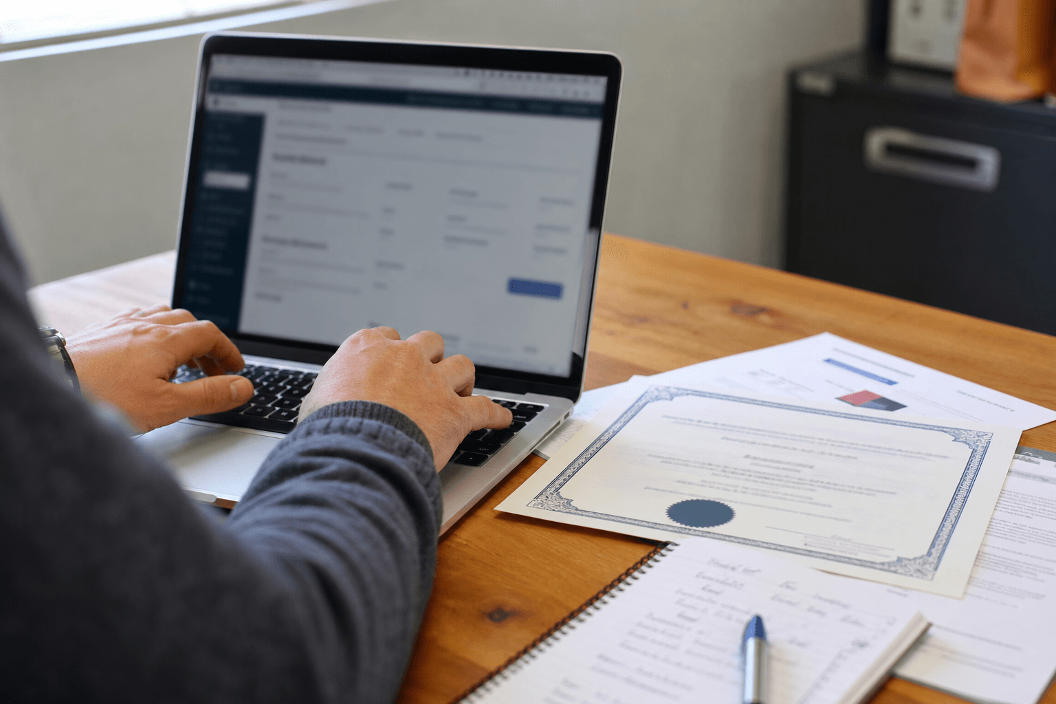 Homeowner verifying a damp surveyor credentials and insurance documents at a desk
