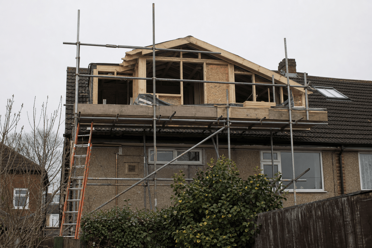 UK semi with dormer loft conversion and scaffolding